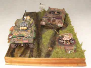 WWII military diorama titled Wittmann's Last Tiger, featuring a German tank wreck and an American Sherman Firefly with a Polish crew - photo No. 2 - side view