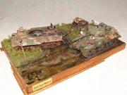 WWII military diorama titled Wittmann's Last Tiger, featuring a German tank wreck and an American Sherman Firefly with a Polish crew - photo No. 6 - side view