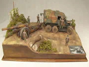 Plastic models of a Scammell Pioneer artillery tractor and a howitzer on a narrow road in an Italy 1943 WWII diorama - photo No. 1 - front view