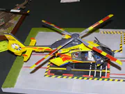 Plastic model of the EC135 air ambulance helicopter - photo No. 2 - side view