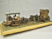 Plastic models of the military omnibus and the Holt 75 tractor in a diorama - photo No. 1 - front view