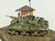 Diorama with a plastic model of the Sherman Firefly tank.